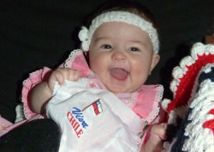 It wasn’t easy just choosing one picture to share with all of you, but this seemed the most appropriate. She is dressed in a traditional Chilean dress for her very first independence day visit to the fairgrounds. Because she is Chilean, this seemed the best photo to share.